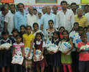 Mangaluru: 40th Block Congress distributes notebooks to 150 poor students